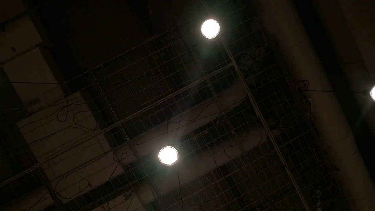 View to the dark ceiling with hanging lamps