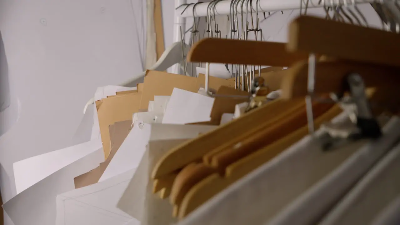 Sewing pattern templates on hangers in fashion designer studio