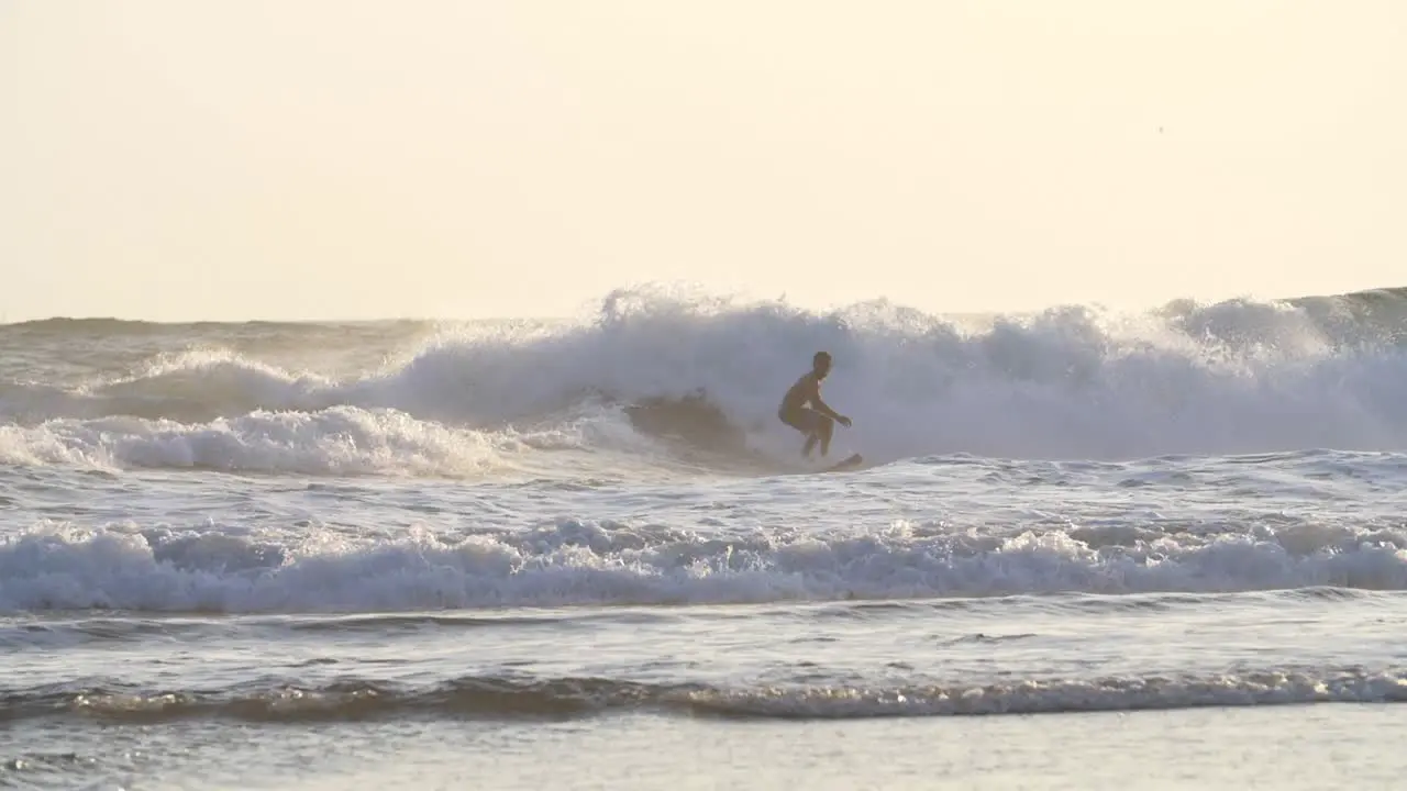 Surfer Falling Off His Surfboard