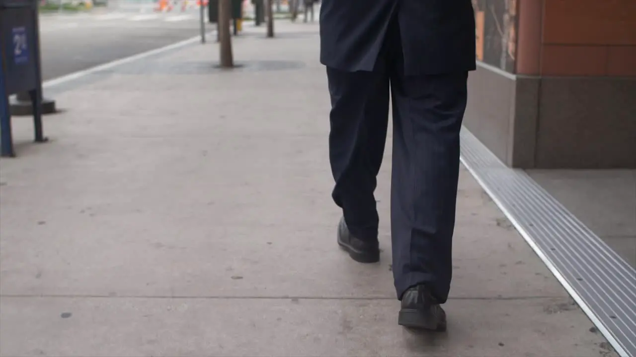 Smartly Dressed Man Walking on Sidewalk