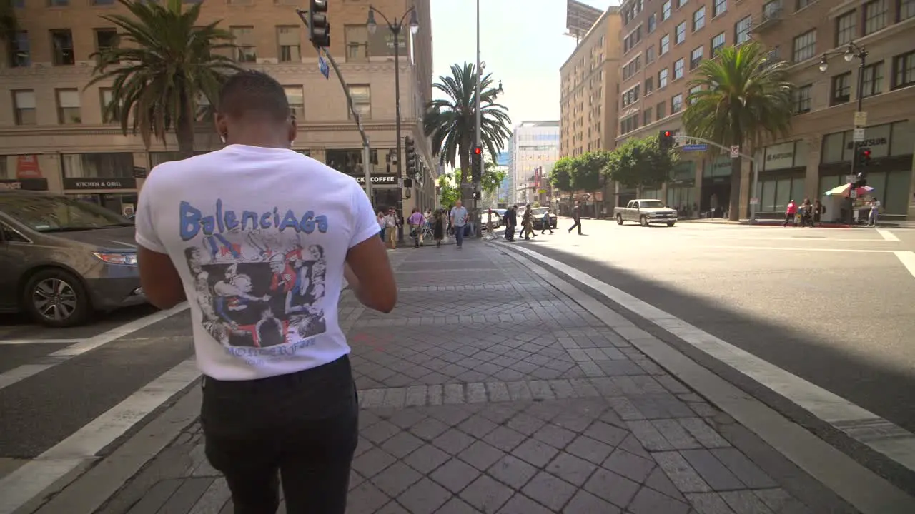 Young Man Crossing Road in Hollywood