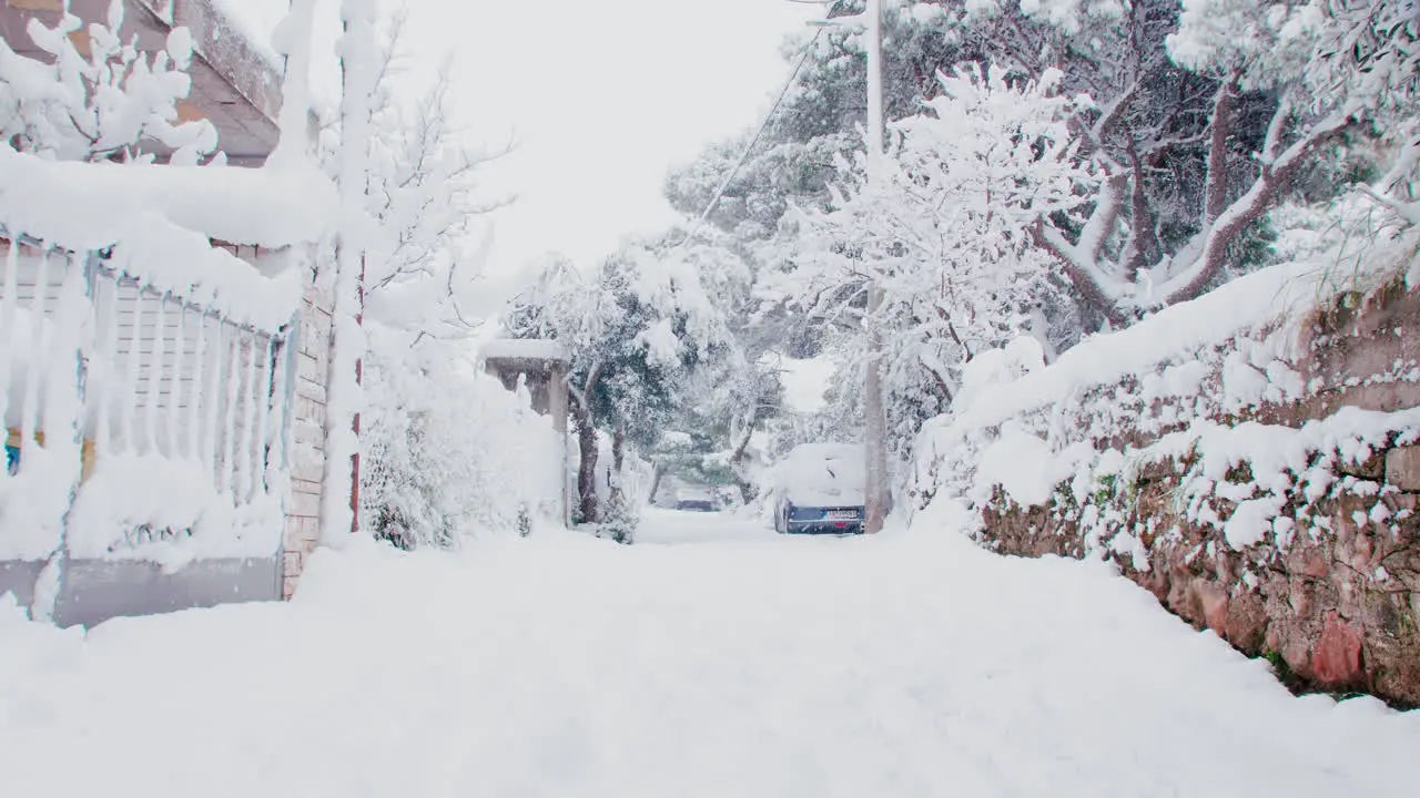 Rare Athens Medea heavy snow covered residential house entrance with light snowfall