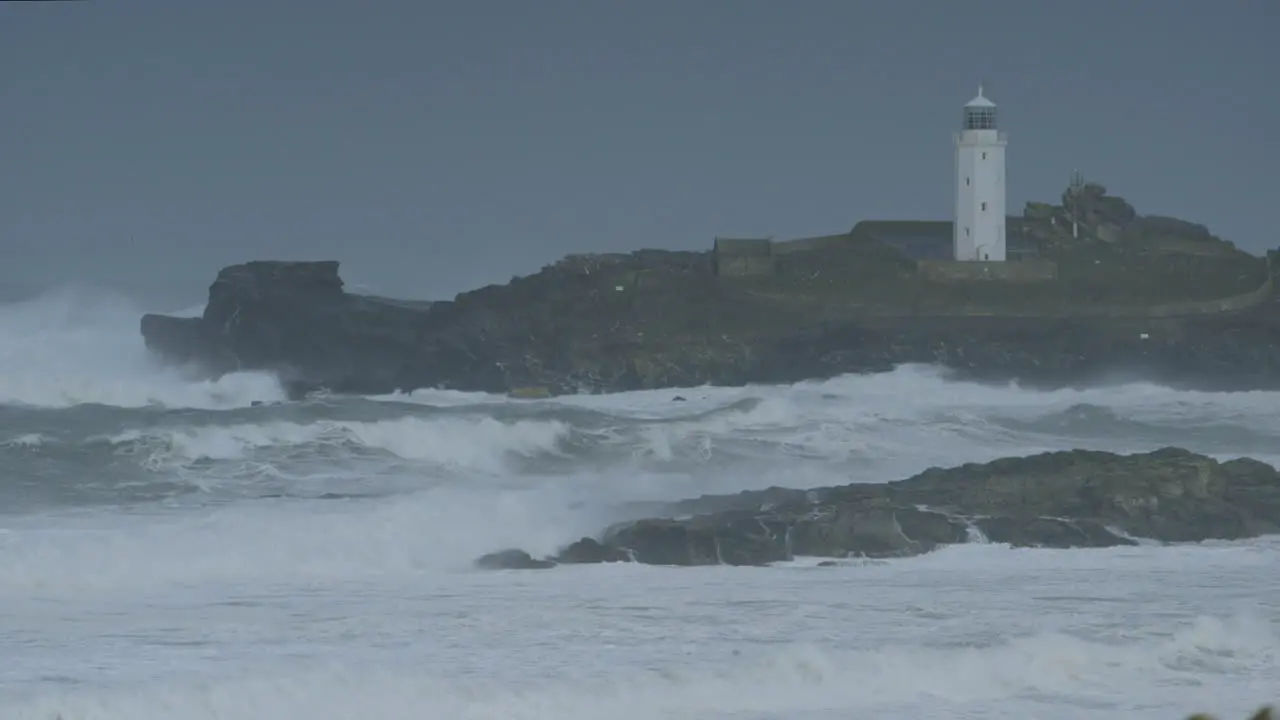 Stunning cinematic close up shot of a stormy sea around a lighthouse