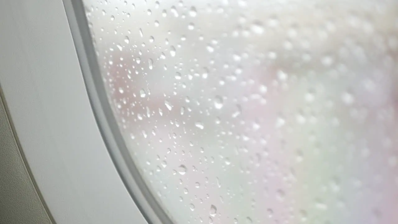 raindrop on the window surface of airplane from inside cabin