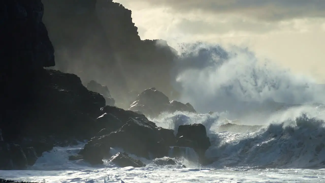 Extreme slow motion of beautiful ocean waves crashing into Kaiaka Rock Molokai Hawaii 8