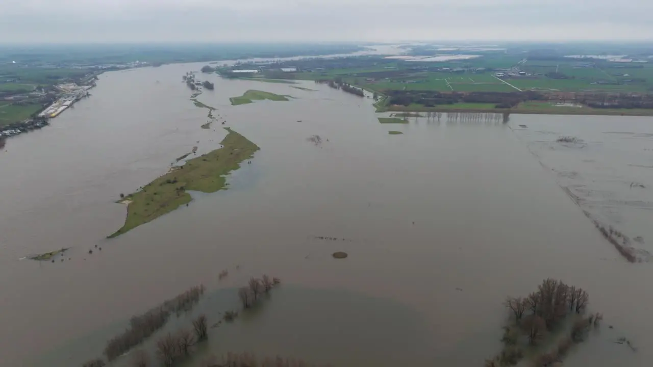 Wide angle aerial view of flooding around river Waal and Poederoijen