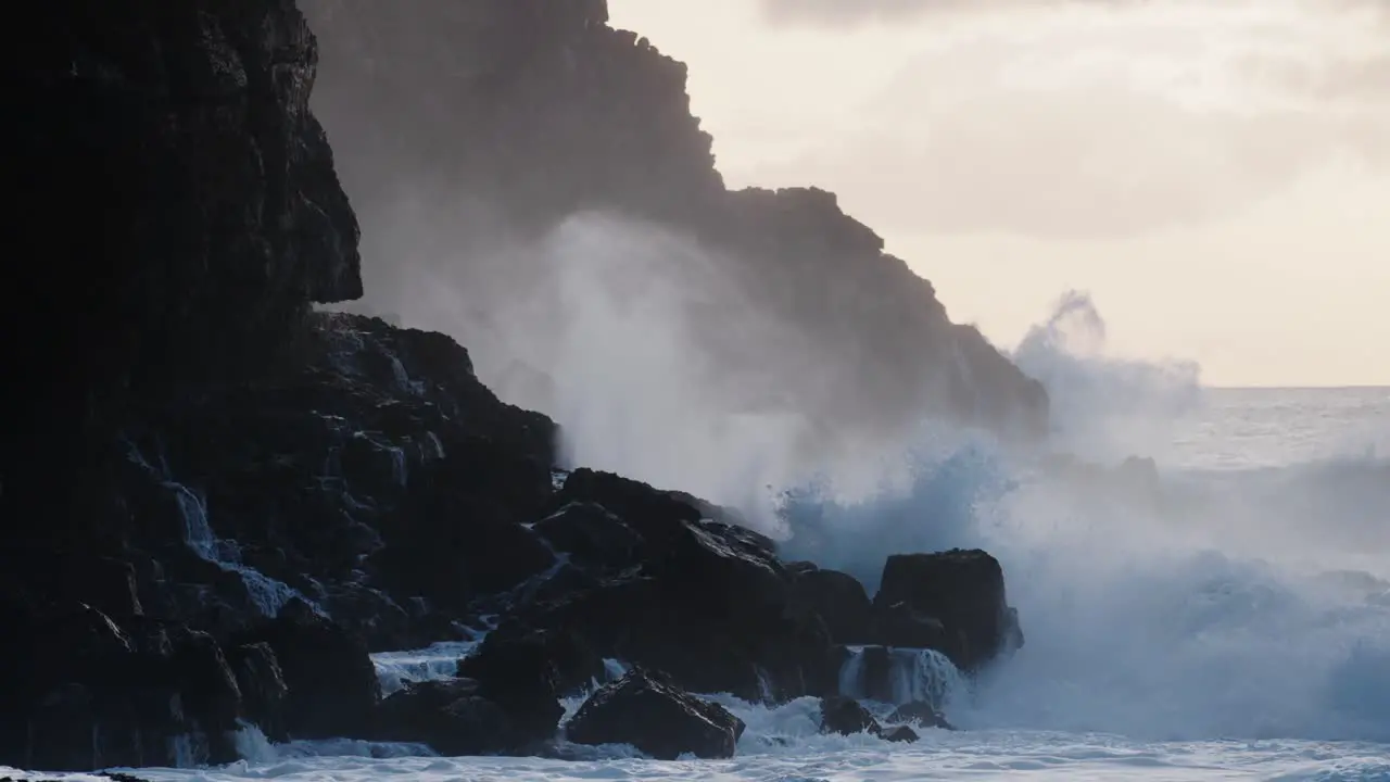 Extreme slow motion of beautiful ocean waves crashing into Kaiaka Rock Molokai Hawaii 1