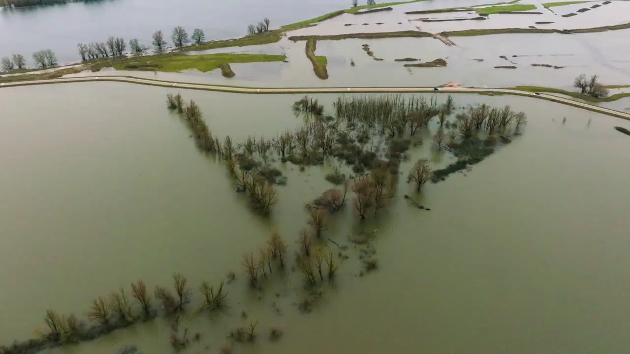 Floodwaters inundating the Dutch landscape around river Waal Poederoijen