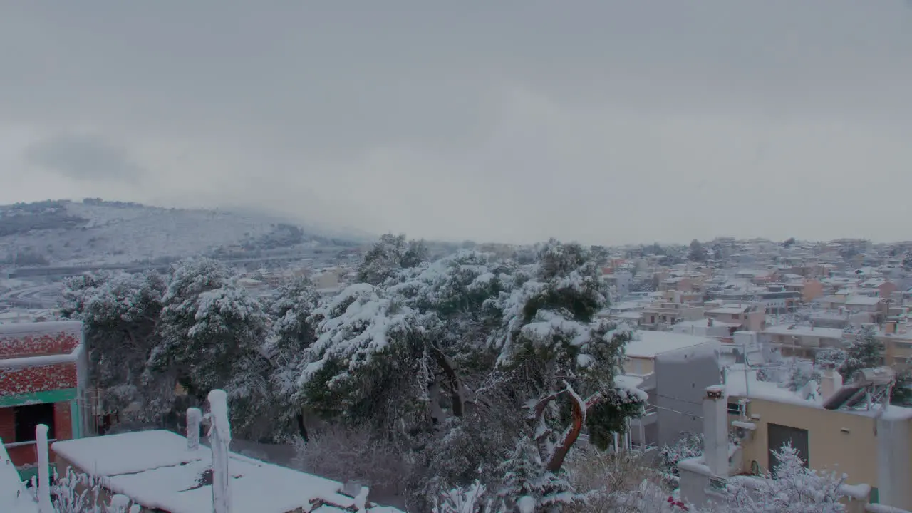 Frozen snow covered neighbourhood landscape during rare stormy Medea snowfall in Athens