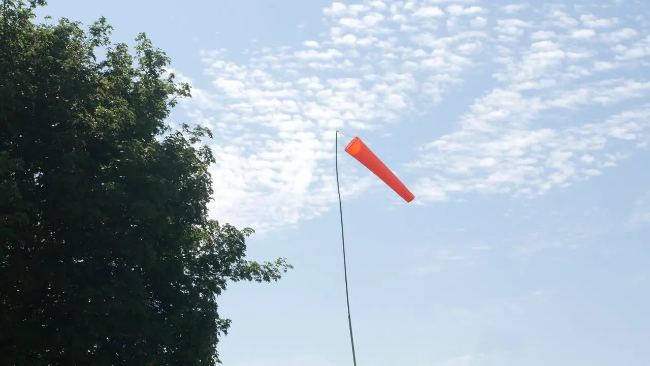 Airfield wind direction windsock flag in summer