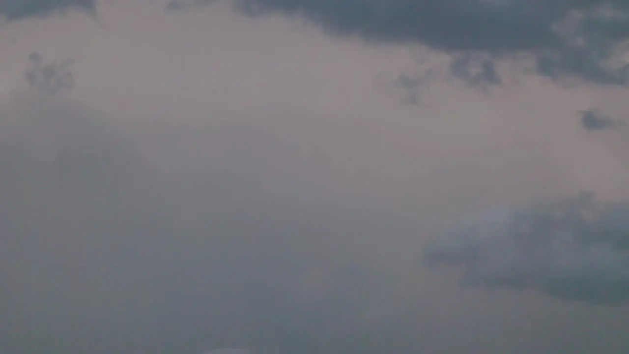 Static shot of lightning striking during a storm day