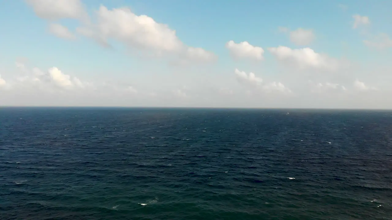 Drone shot flying over ocean near Mexico