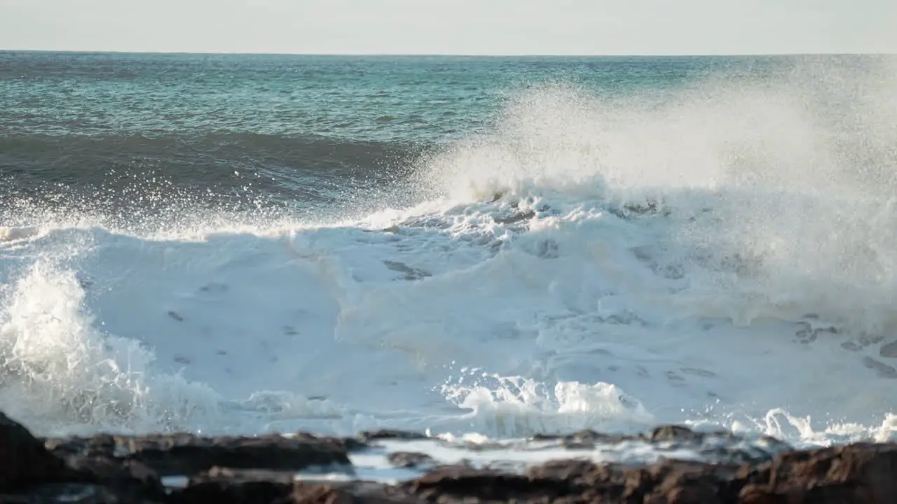 Extreme slow motion of beautiful ocean waves crashing into Kaiaka Rock Molokai Hawaii 10