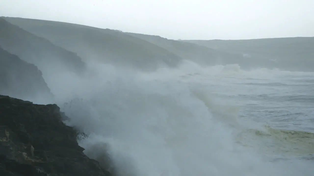 Stunning cinematic shot of a huge storm battering the coast near Porthleven