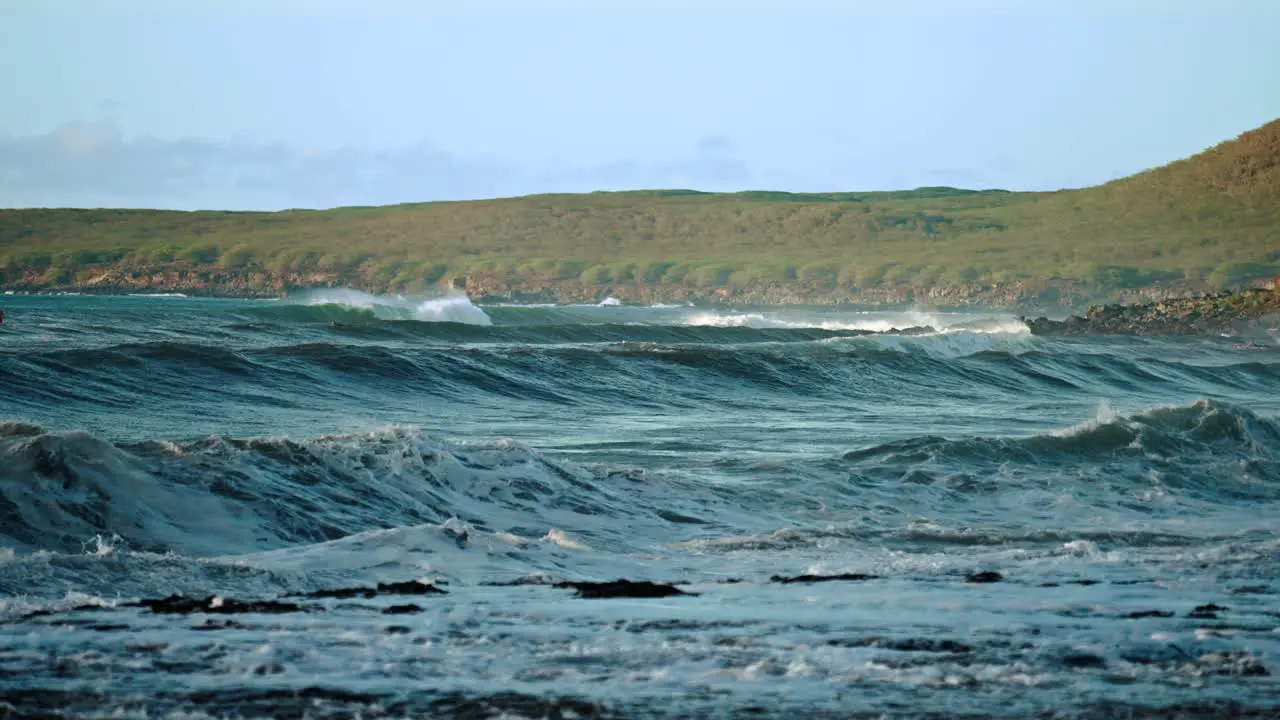 Extreme slow motion of beautiful ocean waves crashing into Kaiaka Rock Molokai Hawaii 11