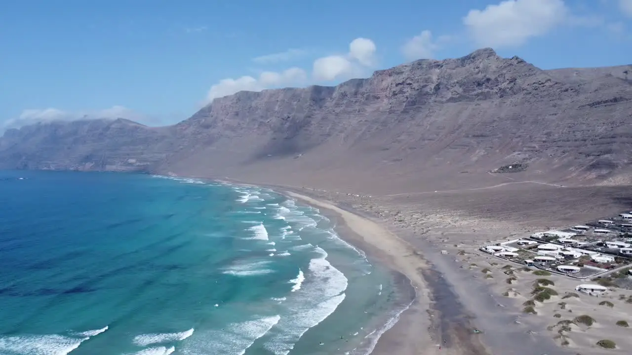 amazing sunny beach with waves famara in the north of lanzarote perfect blue sky