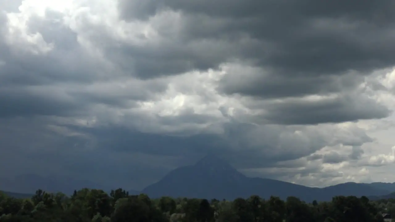 Time-lapse of dark storm clouds over an Austrian mountain