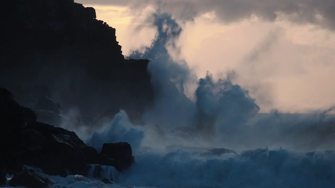 Extreme slow motion of beautiful ocean waves crashing into Kaiaka Rock Molokai Hawaii 2