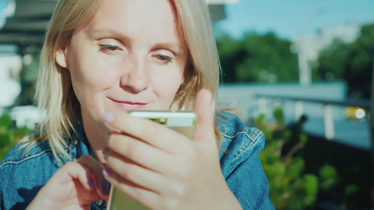 Portrait Of A Woman With A Smartphone Relax On The Summer Terrace In The Cafe 4K Video