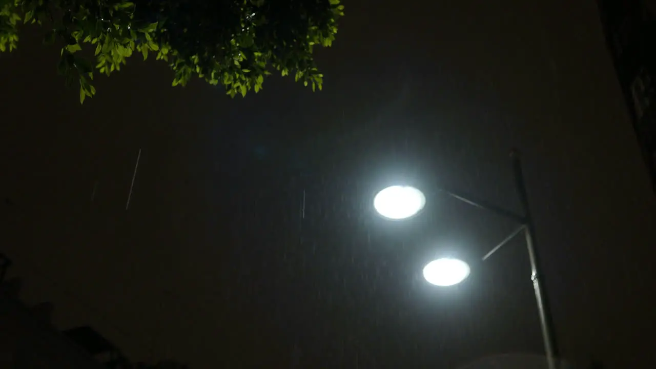 Street lantern under the rain at night