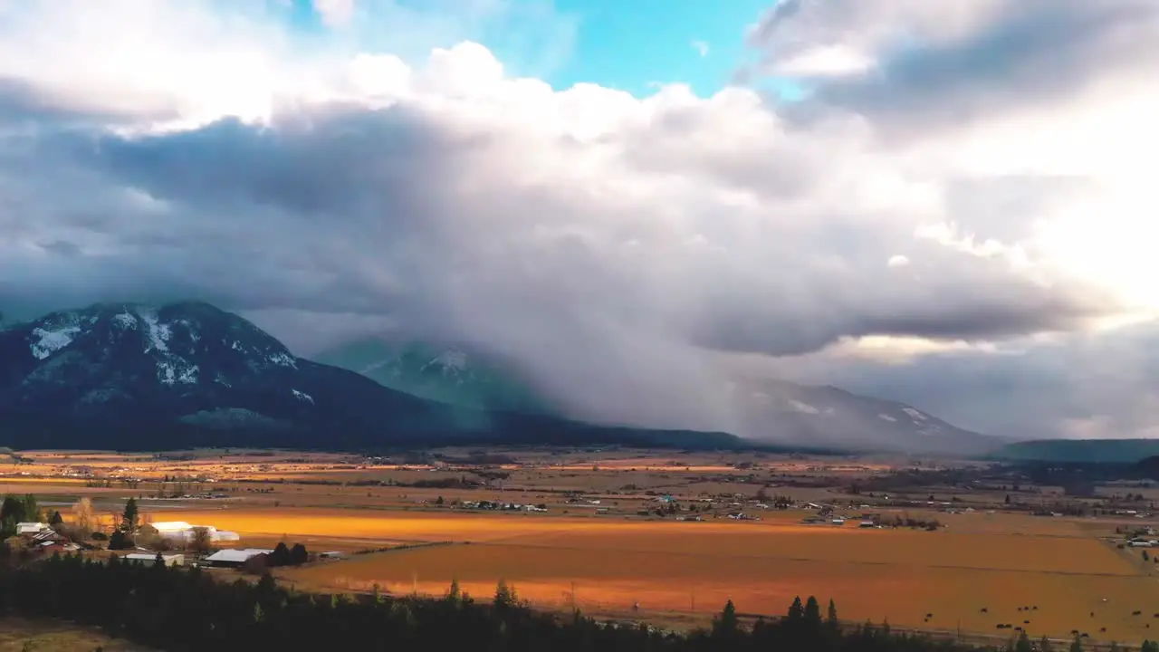 Snow squall over Montana yellow fields Rocky Mountains time lapse