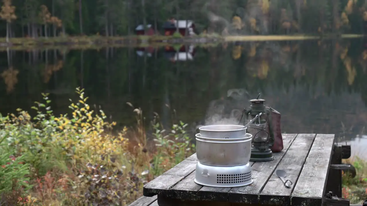 Cooking food infront of a small lake with