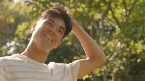 Close Up Shot of a Young Man Smiling and Posing