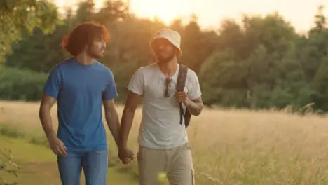 Tracking Shot of Homosexual Couple Walking at Sunset