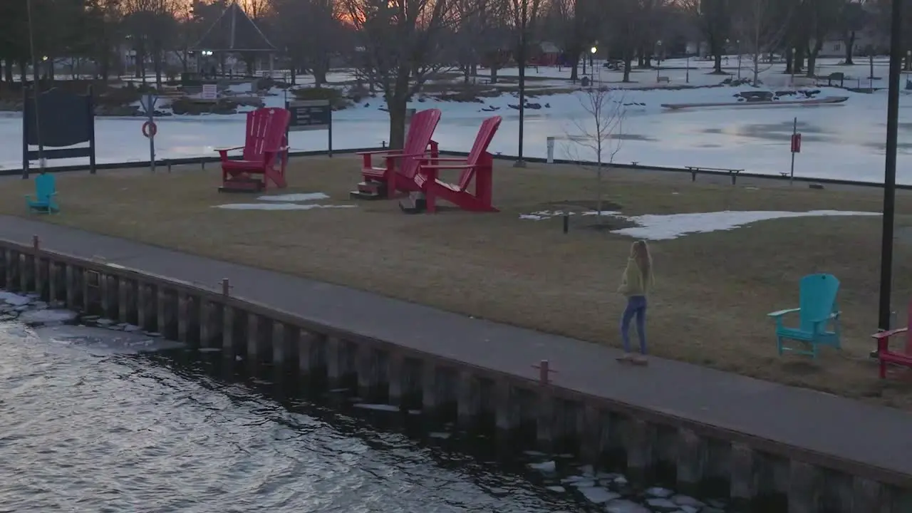 young women enjoying a late winter evening without snow aerial looking at camera