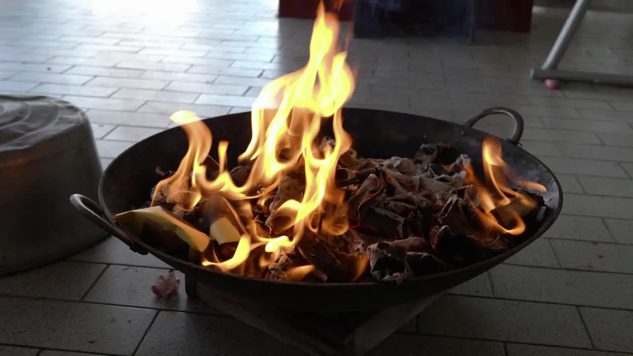 Medium shot burning joss paper