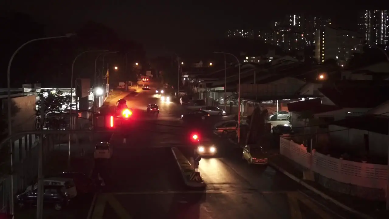 Night View Of Street Traffic In Town With Numbers Countdown Traffic Light Turn Red To Green