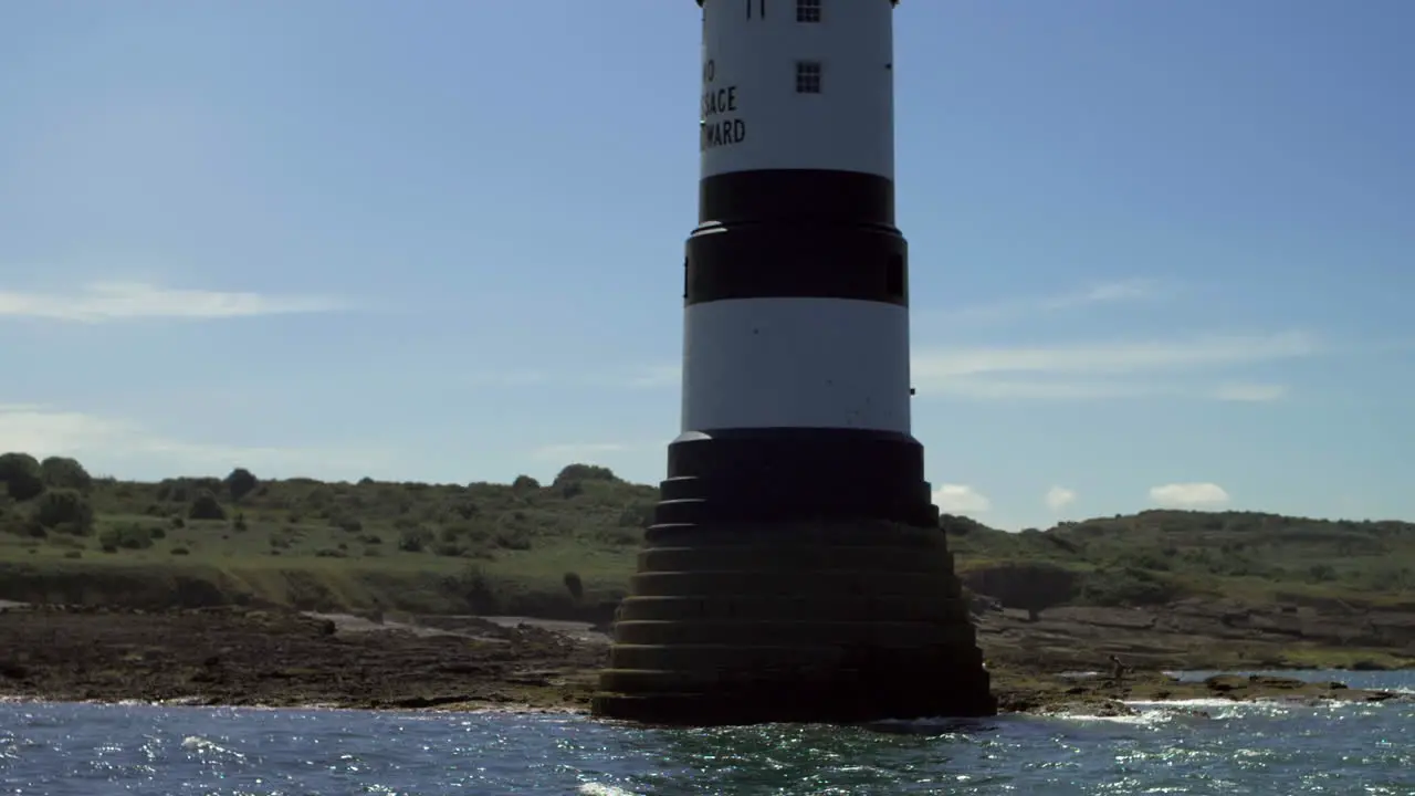 Slow motion Speed Boat Passing Fast Light house