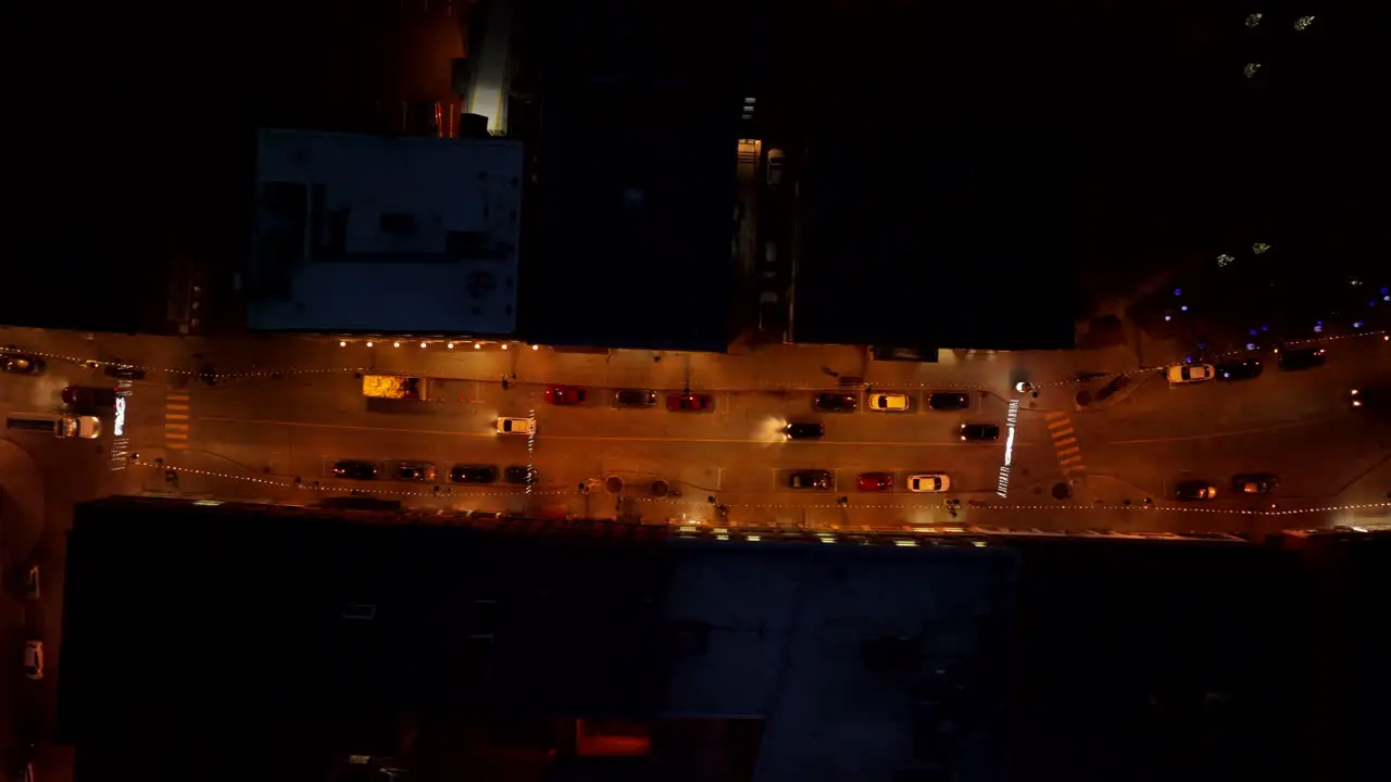 Top Down View Of Vehicles Driving In The Street Of Sherbrooke City At Night aerial drone shot