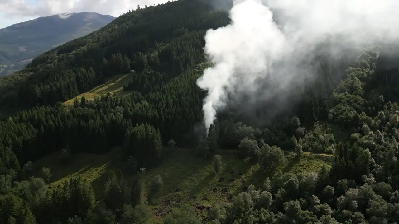 Farmers Burning Waste on a Hillside creating a Large Smoke Cloud in Vik i Sogn Norway