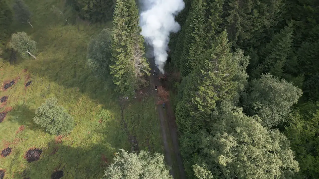 Ashes from Waste Burning Flying Everywhere and Farmers feeding the Fire Vik i Sogn Norway