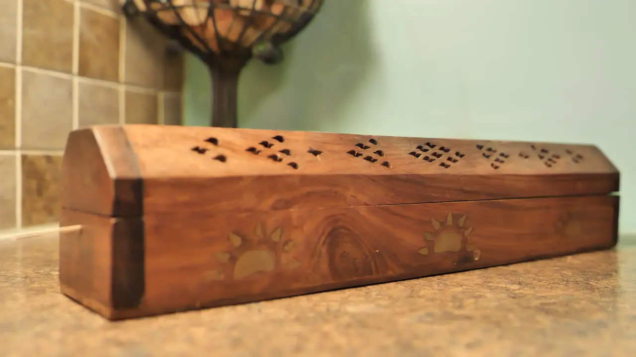 Close up of incense burning in wood censer