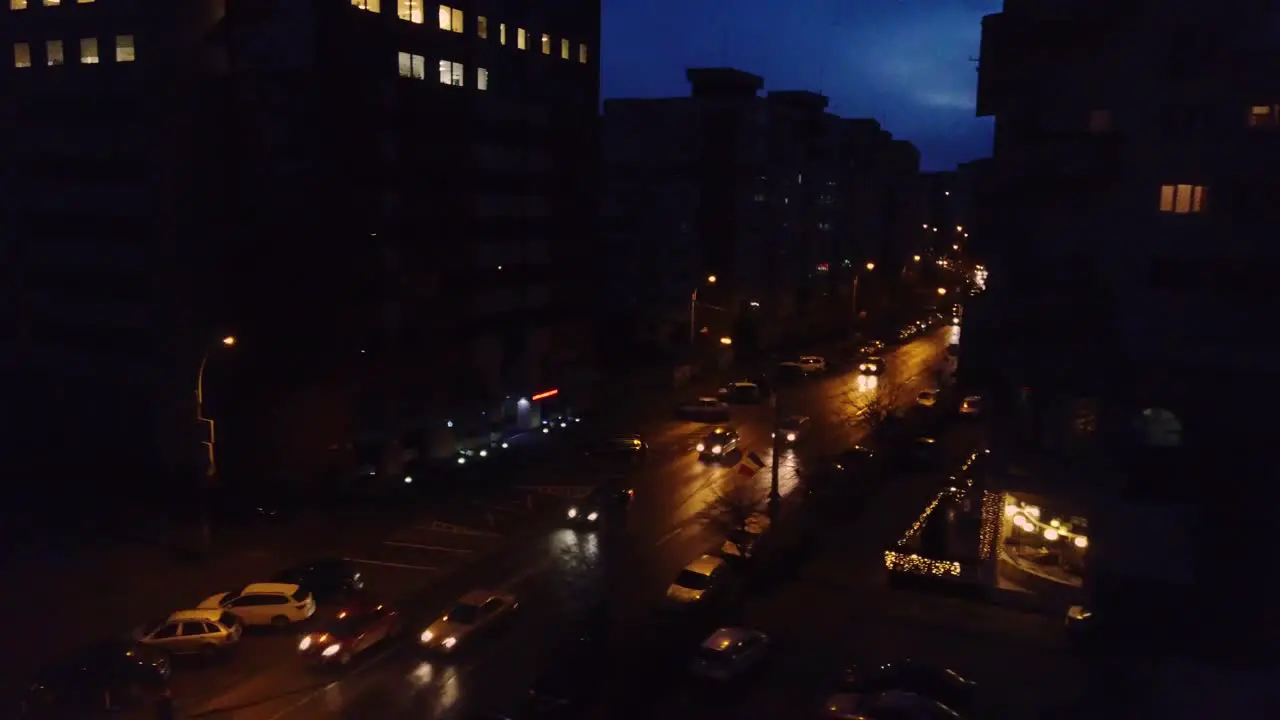 Wide aerial shot of city street at night time