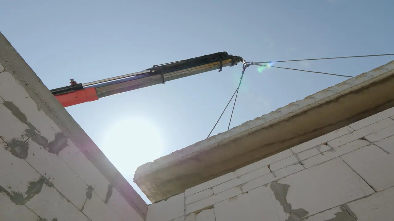 The Crane Sets The Floor Panel In A Small House Construction Of Cottages