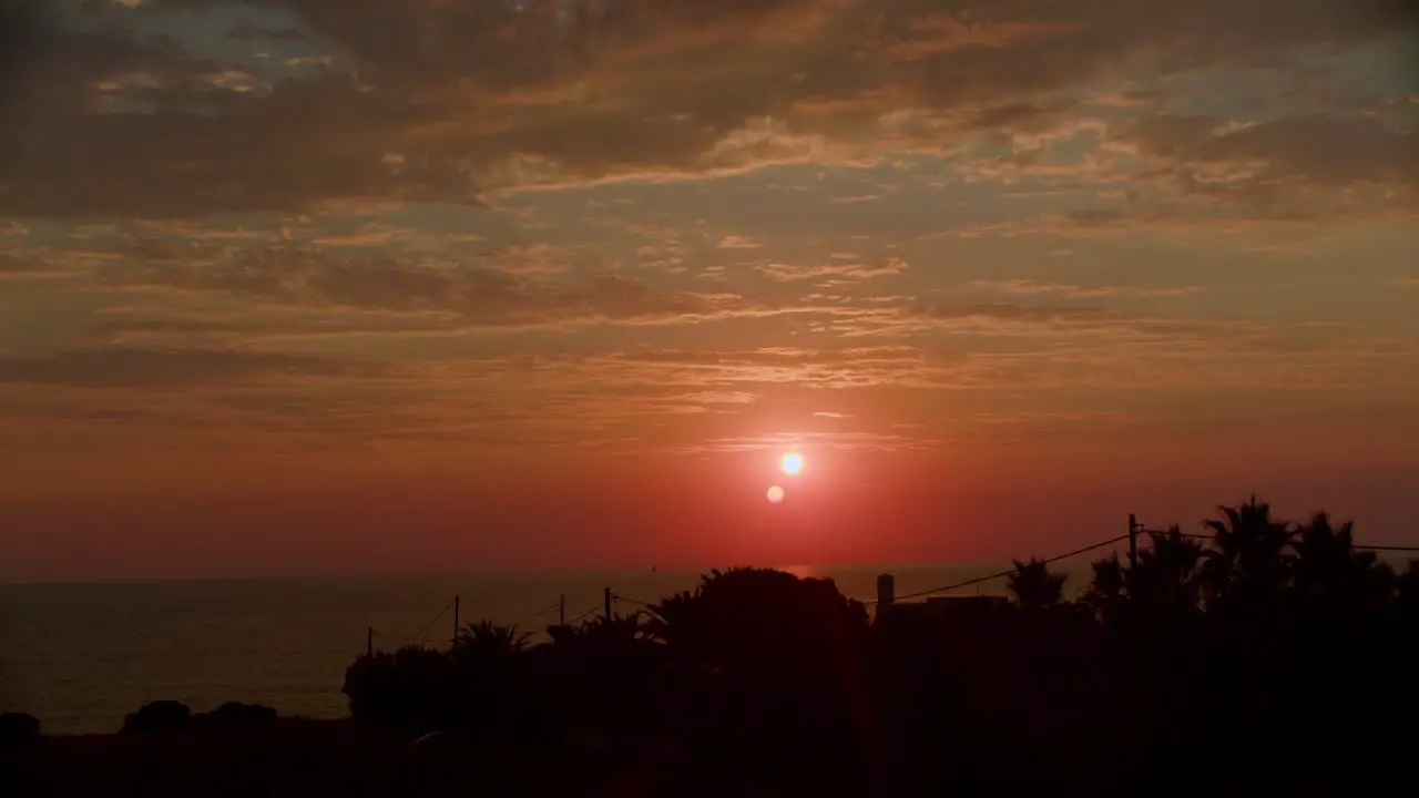 Sunset time lapse and clouds rolling over a Greek summer sea