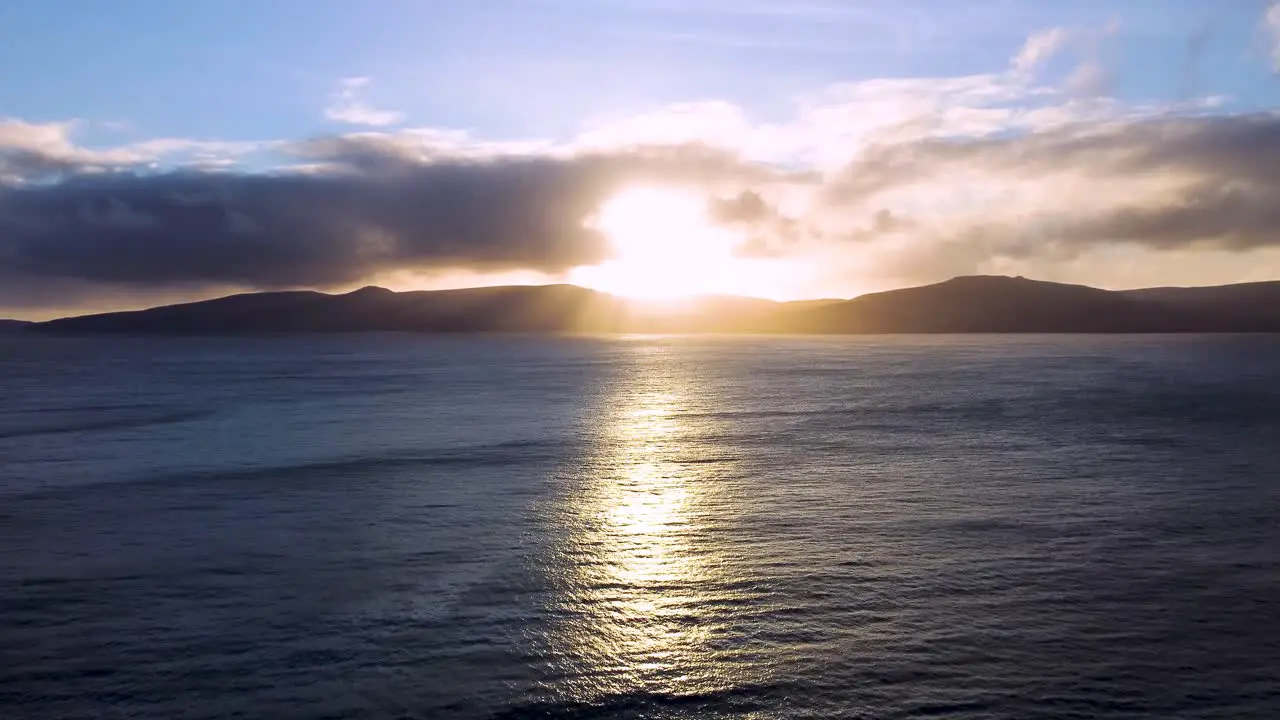 Aerial view of sun setting behind Vagar Faroe Islands