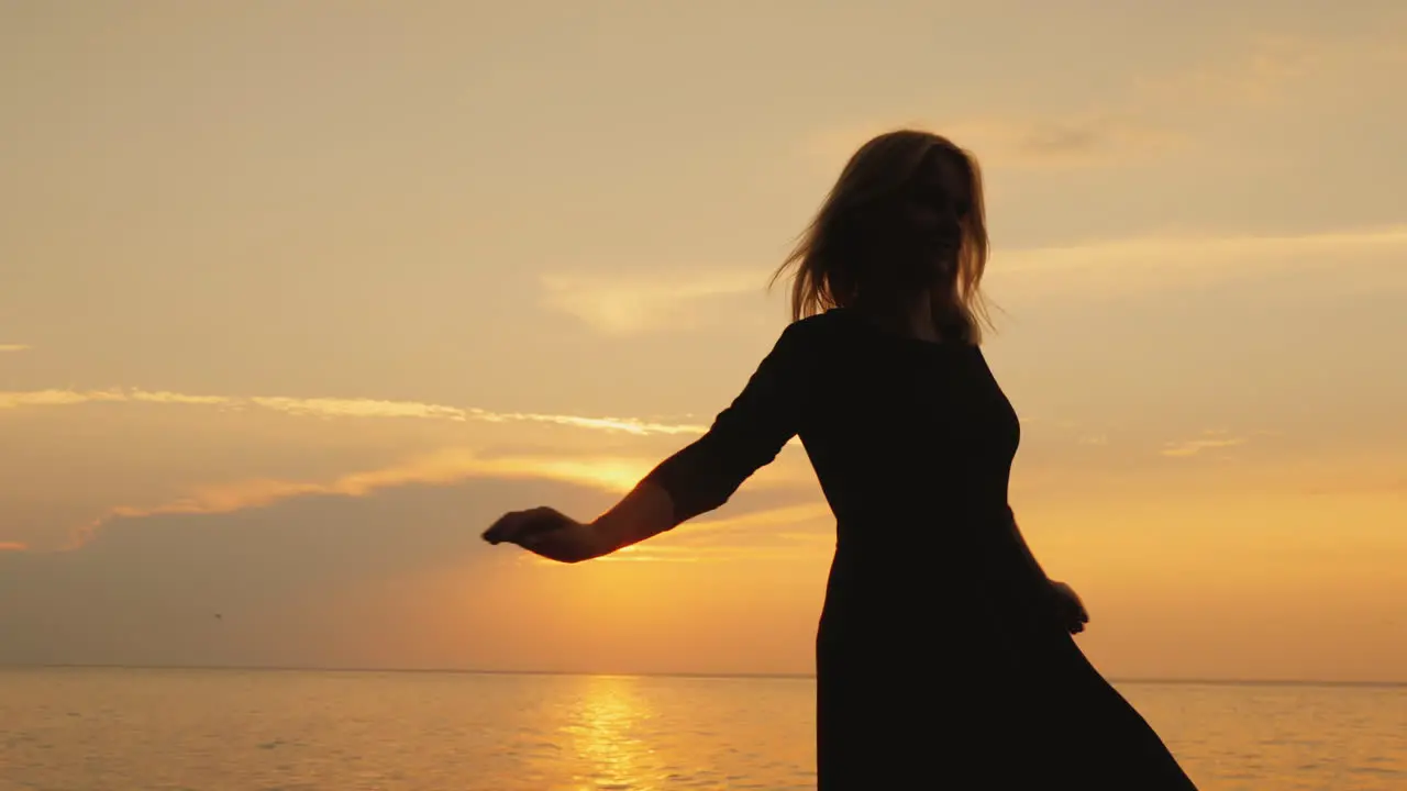 Emotional Woman Rejoices On A Summer Day Spinning In A Dress