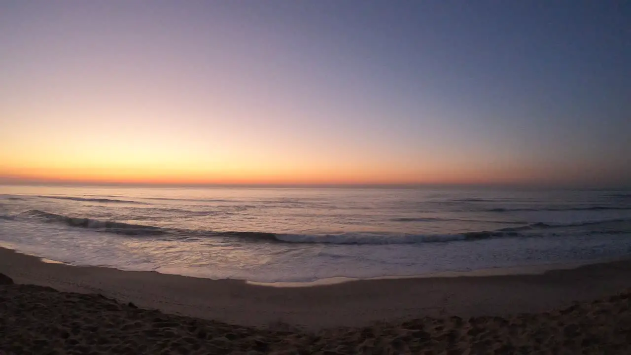 Cold orange sunset over Maceda Beach ocean in Portugal