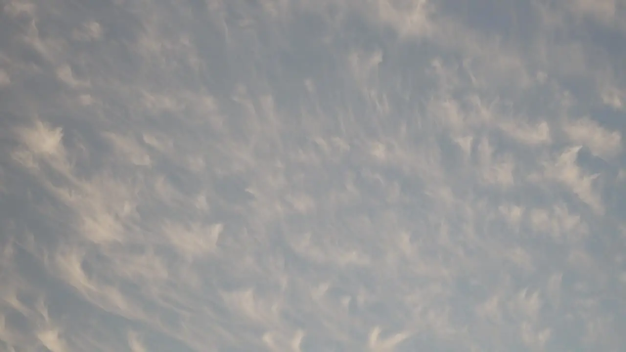 Orange clouds spread out during sunset