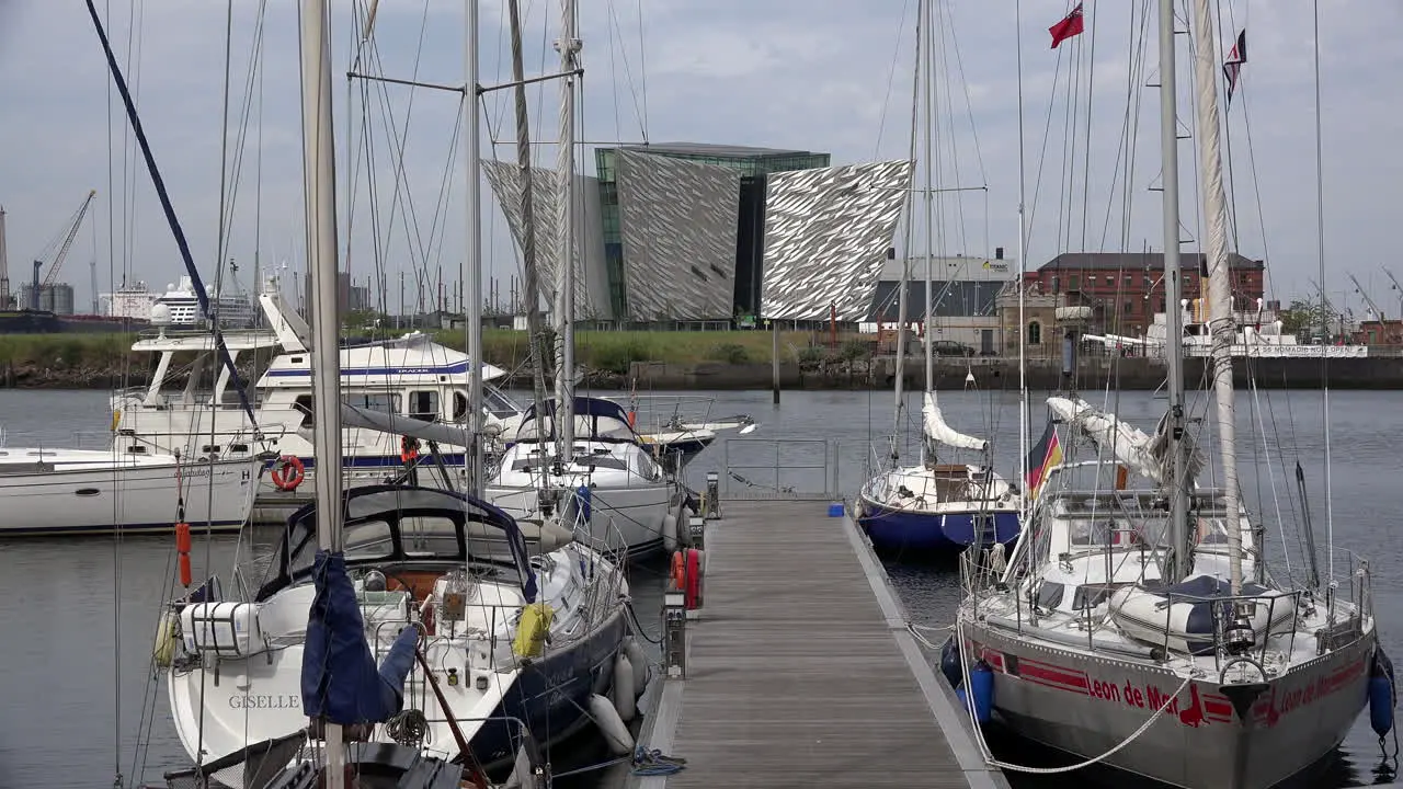 Northern Ireland Belfast Titanic Museum And Boats In Marina With Man 