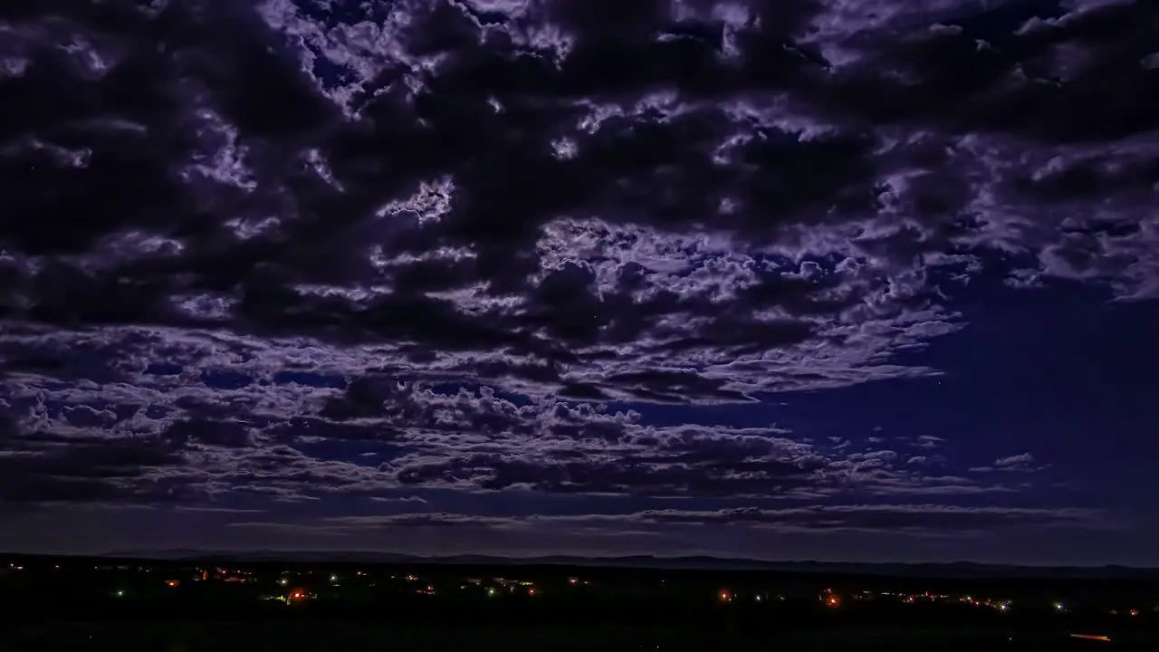 A nighttime cloudscape time lapse during a full moon above the Morocco desert