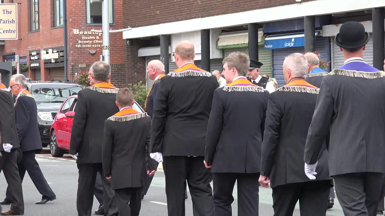 Northern Ireland Orangemen Marching In Small Town