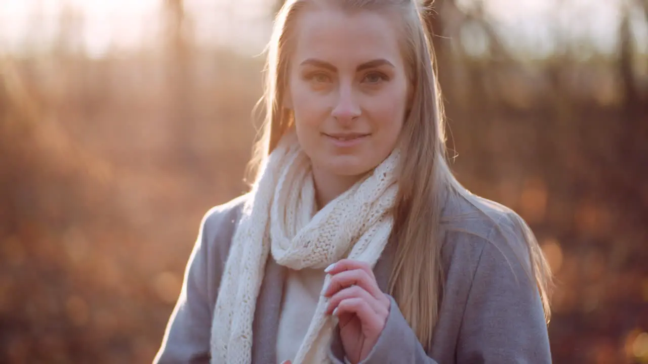 Portrait Of Positive Female Walking In Woods In Autumn 2