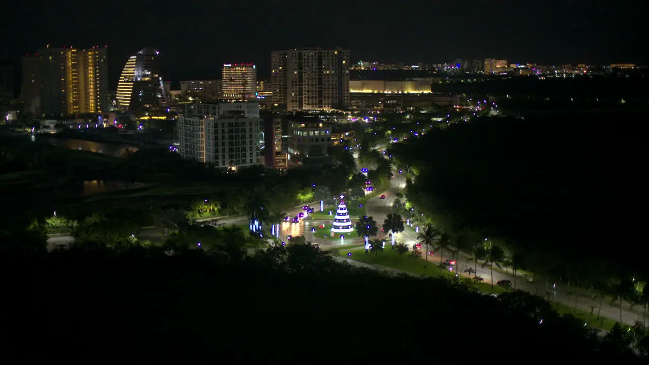 Aerial view of boulevard kukulkan in Cancun Mexico at night with cars driving by