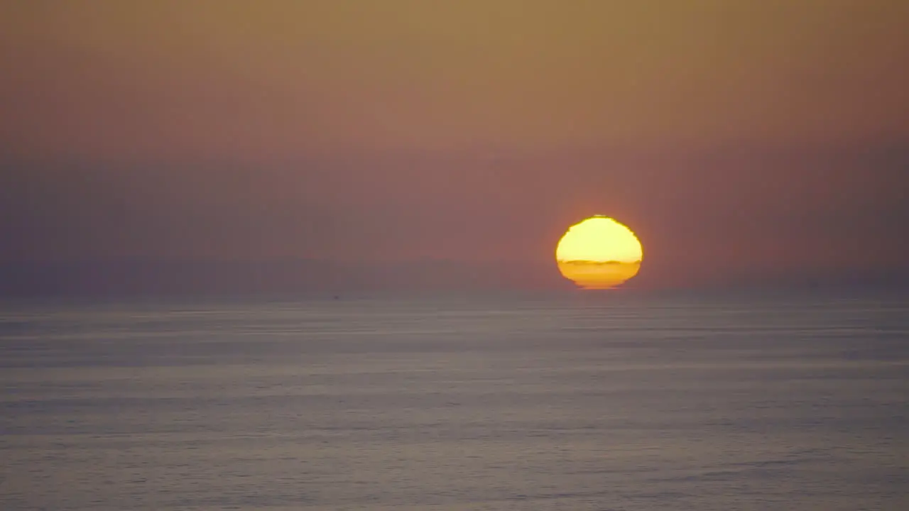 Pastel colored sunset over pacific ocean timelapse