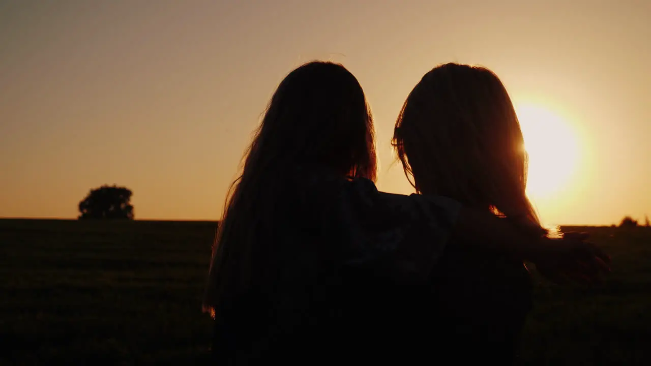 Mom And Daughter Are Admiring The Sunset Gentle Mother With Baby 4K Slow Motion Video